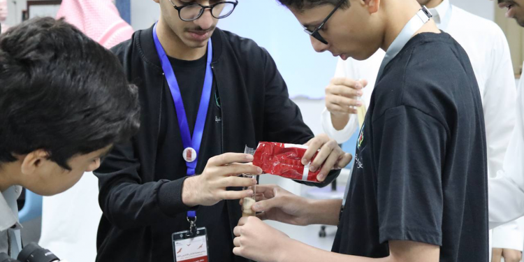 Saudi students doing experiment at The Academic Talent Enrichment Program.