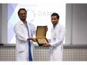 The Director of KFHU honors DAMS Volunteers